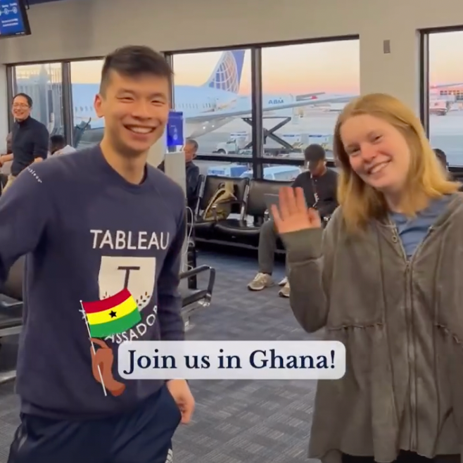 BGA students in the airport waving hello